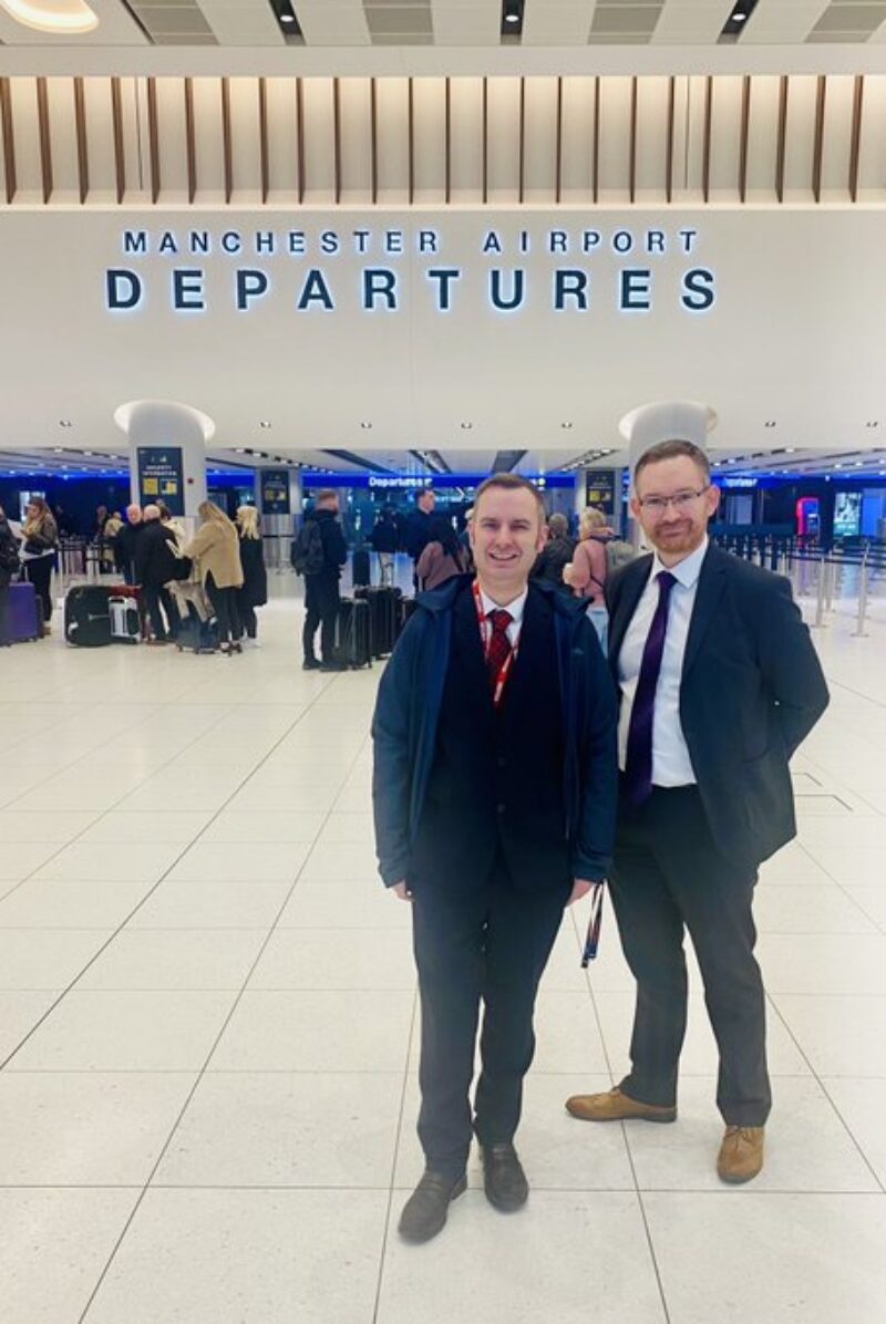 Cllr Tom Ross pictured at Manchester Airport with Adam Freeman. 